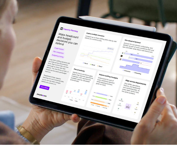 woman holding ipad looking at peopleware capacity planning overview